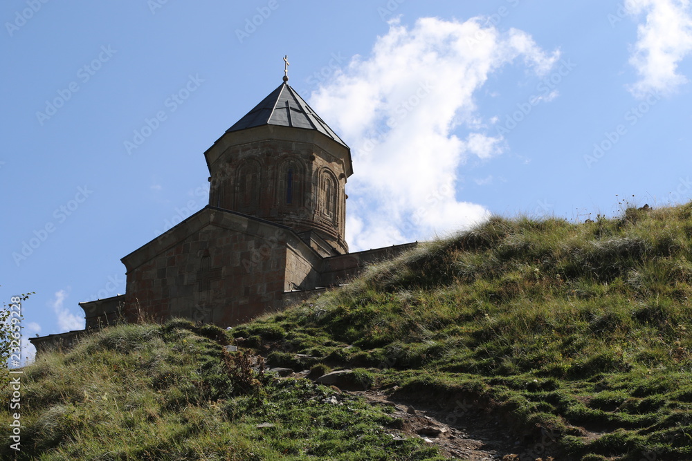 Stepantsminda church on mountain