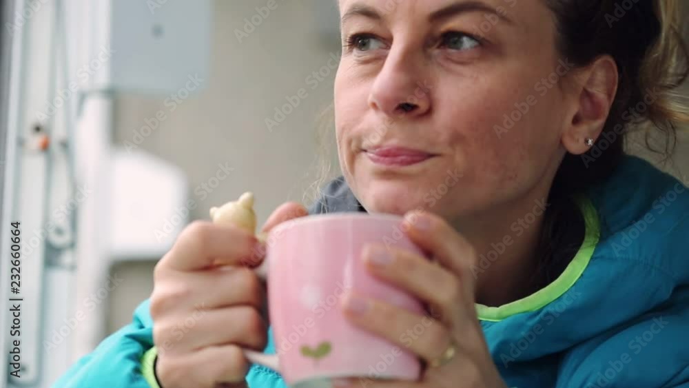 Woman drinking herbal tea and relaxing outdoors. Woman drinking herbal tea and relaxing outdoors.