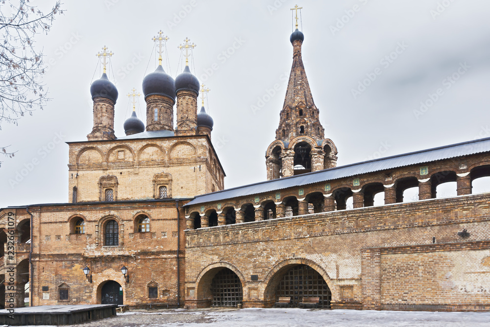 Monastery with belfry and passage