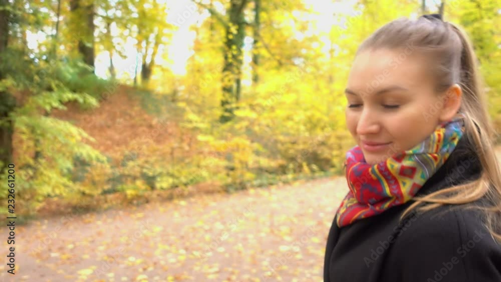 Girl is walking in the autumn forest Girl is walking in the autumn forest