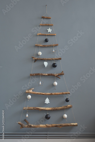 Minimal handmade Christmas tree by the wall indoor