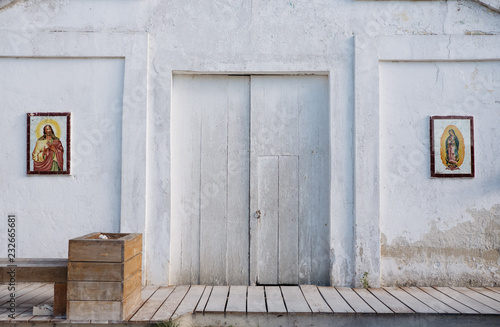 white church facade of the streets of mexico photo