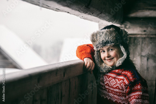 Winter Portrait of Beautiful Smiling Norwegian Girl in Tradition photo