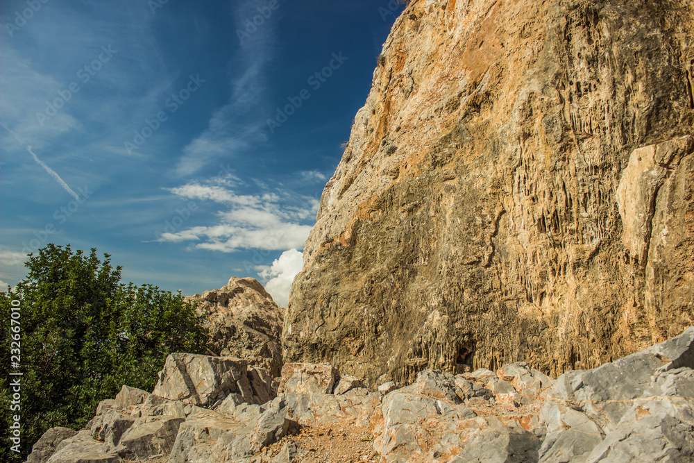 summer vivid mountain rock scenic landscape of dry stone and contrast blue sky
