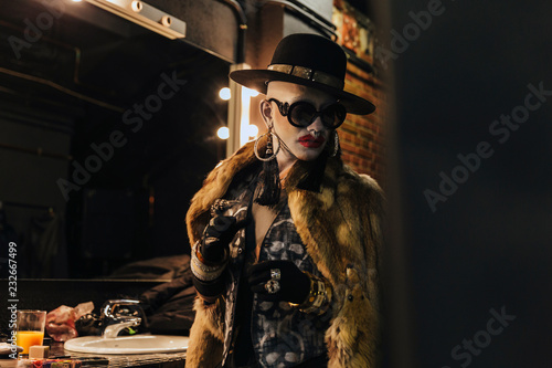 Fashion elegant bizarre man with extreme makeup