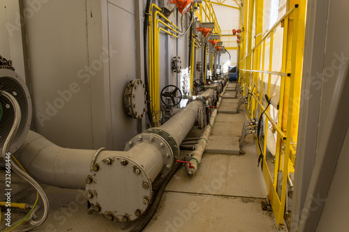 pumping unit and piping under cover