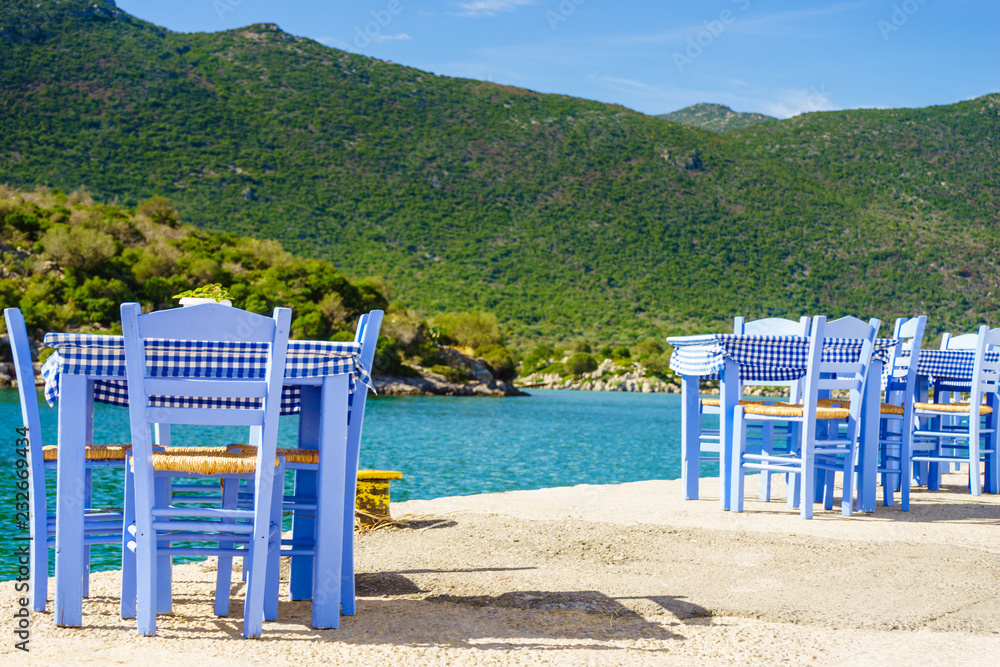 Open cafe outdoor restaurant in Greece on sea shore Open cafe outdoor restaurant in Greece on sea shore