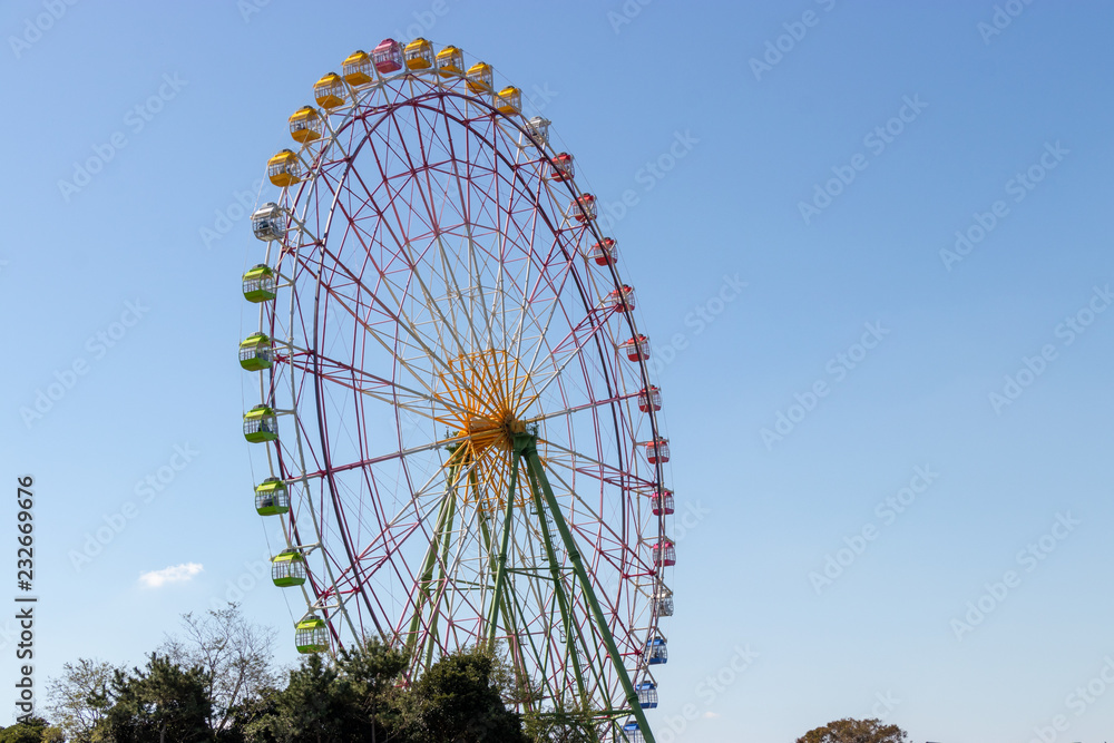 Autumn's blue sky and Ferris wheel Autumn's blue sky and Ferris wheel