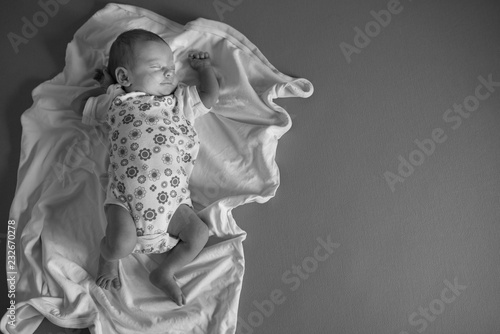 Nweborn baby sleeping, top view and copy space photo