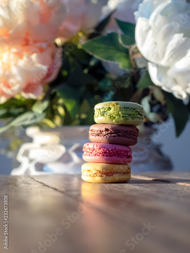 Stack of macaroons on rustic wooden table photo