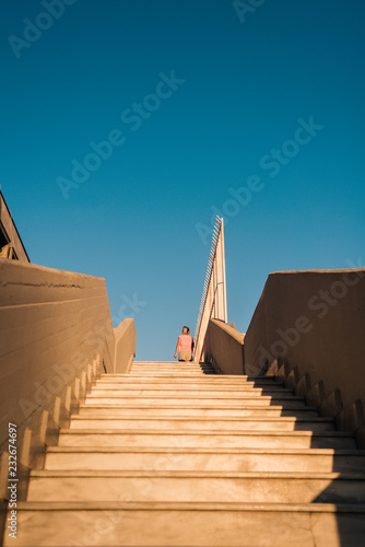 Young fit girl jogging on steps