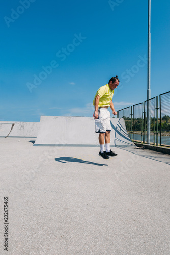 Young man doing tricks while jump in the air