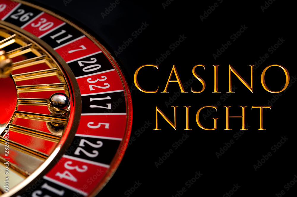 Casino night poster and gambling on games of chance concept with the ball in the winning number seventeen on a roulette wheel isolated on black background with gold text that reads Casino Night Casino night poster and gambling on games of chance concept with the ball in the winning number seventeen on a roulette wheel isolated on black background with gold text that reads Casino Night