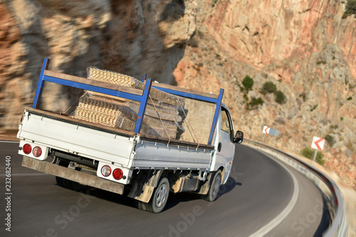 Quadro em tela flatbed truck with cargo in mountains road