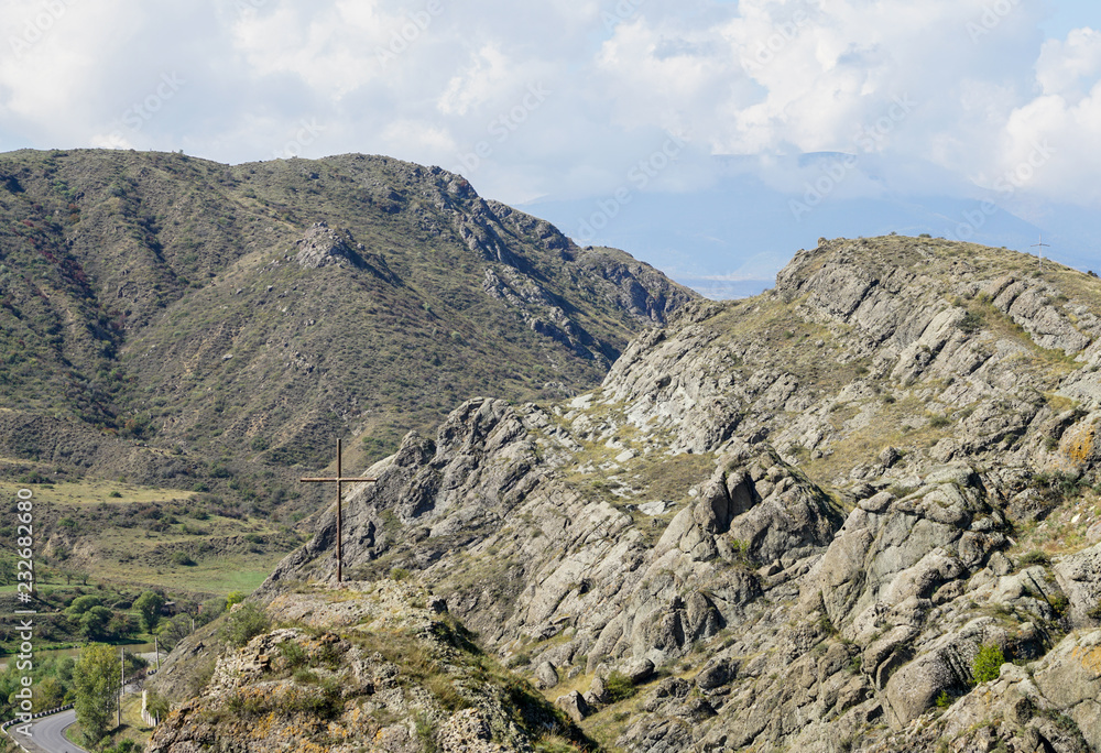 mountain panoramic view with iron cross against the blue sky mountain panoramic view with iron cross against the blue sky