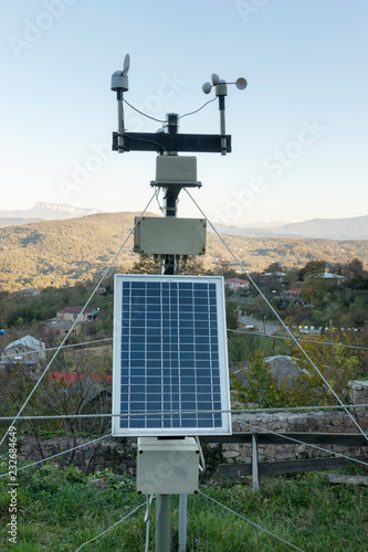 Scientific weather station with solar panel attached