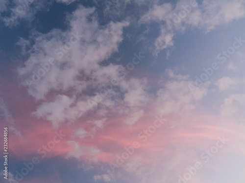 Pink sunset cloud with low wisps