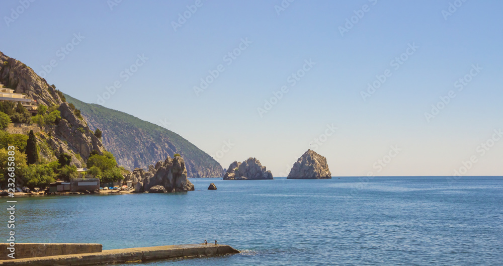 Picturesque Bay of the Black sea with separate rocks on the horizon.Crimea.