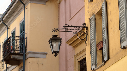 palazzi colorati d'epoca con lampione ad arona in italy, historic colored palace with streetlamp in Arona in Italy
