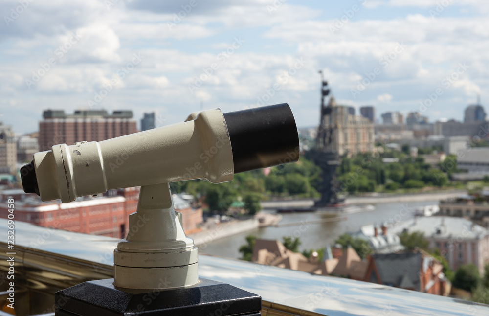 Touristic telescope look at the city with view of Moscow Touristic telescope look at the city with view of Moscow