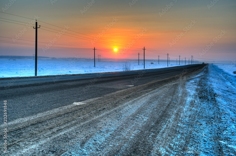 Winter sunset on a country road