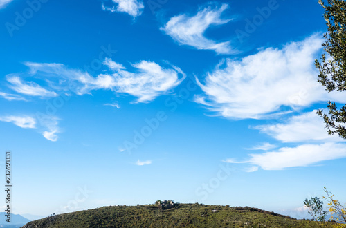 Idyllic Blue Cloudy Sky with Landscape and Castle Ruins