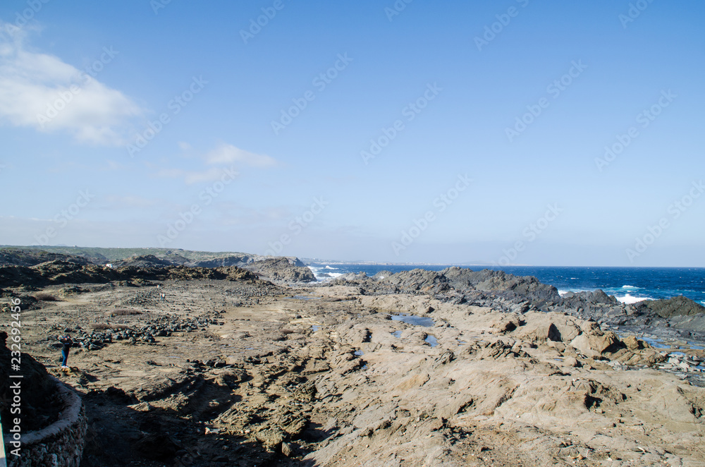Photograph of a landscape with a view of the sea from a rocky coast. Photograph of a landscape with a view of the sea from a rocky coast.