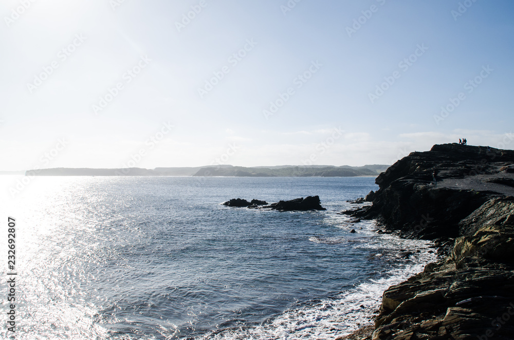 Photograph of a landscape with a view of the sea from a rocky coast.