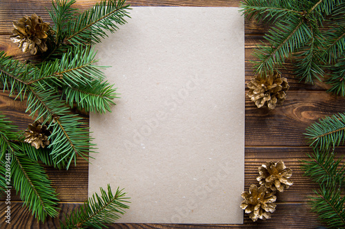 Golden pine cones and fir tree branches, mock up. COpy space.