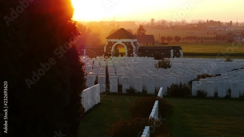The largest and most visited british war cemetery : Tyne Cot, Ypres, Belgium at sunset photo