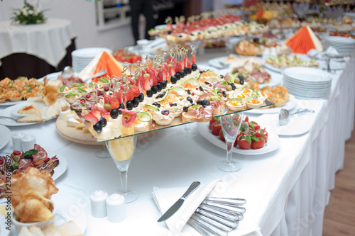 buffet table at the banquet. Festive food. Outgoing catering © alipko