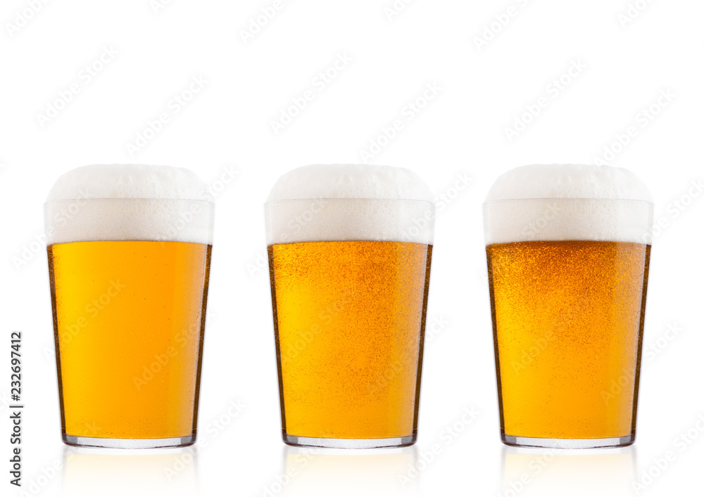 Cold glasses of lager beer with foam and dew Cold glasses of lager beer with foam and dew