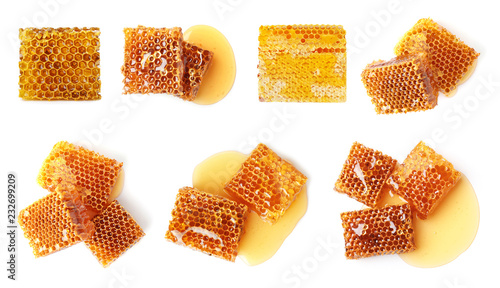 Set with sweet honeycomb pieces on white background, top view