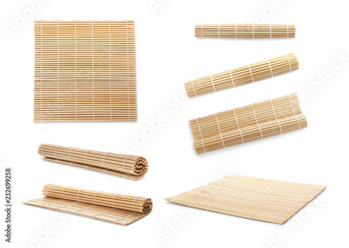 Set with bamboo mat on white background photo