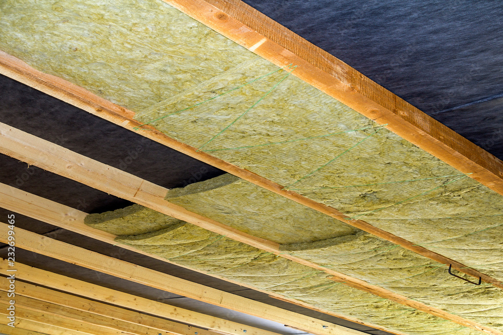 Thermal insulation mineral rock wool installation at the new building ...