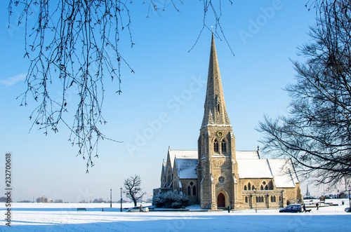 Photography All Saints church at Blackheath Village in south east London on a snowy day