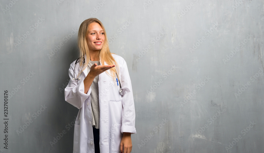 Young doctor woman presenting an idea while looking smiling towards Young doctor woman presenting an idea while looking smiling towards