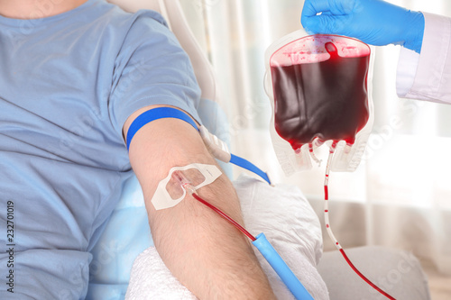 Man donating blood to save someone s life in hospital