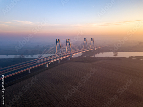 foggy bridge on the Vistula at sunset, Krakow, Poland