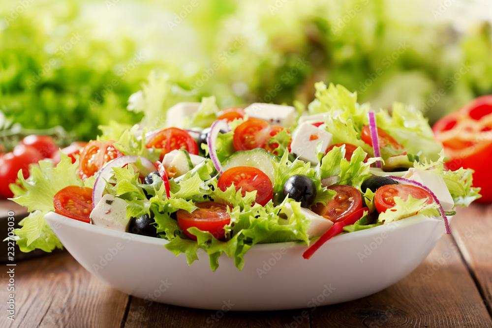 bowl of fresh salad with vegetables and greens bowl of fresh salad with vegetables and greens