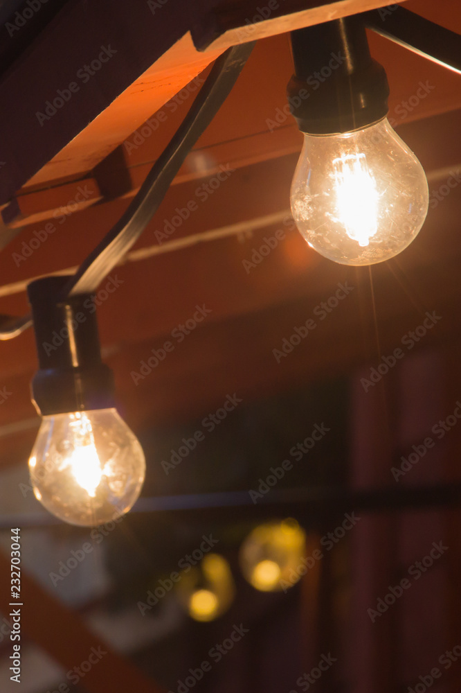 Glowing incandescent lamp with soft light background