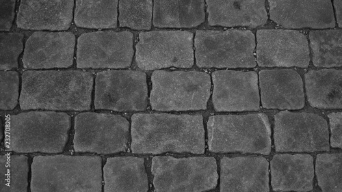 Stone pavement texture black and white. cobblestone background