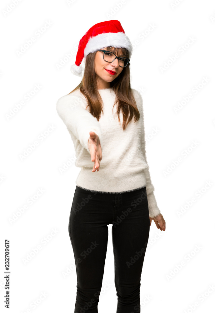 Girl with celebrating the christmas holidays shaking hands for closing a good deal on isolated white background Girl with celebrating the christmas holidays shaking hands for closing a good deal on isolated white background