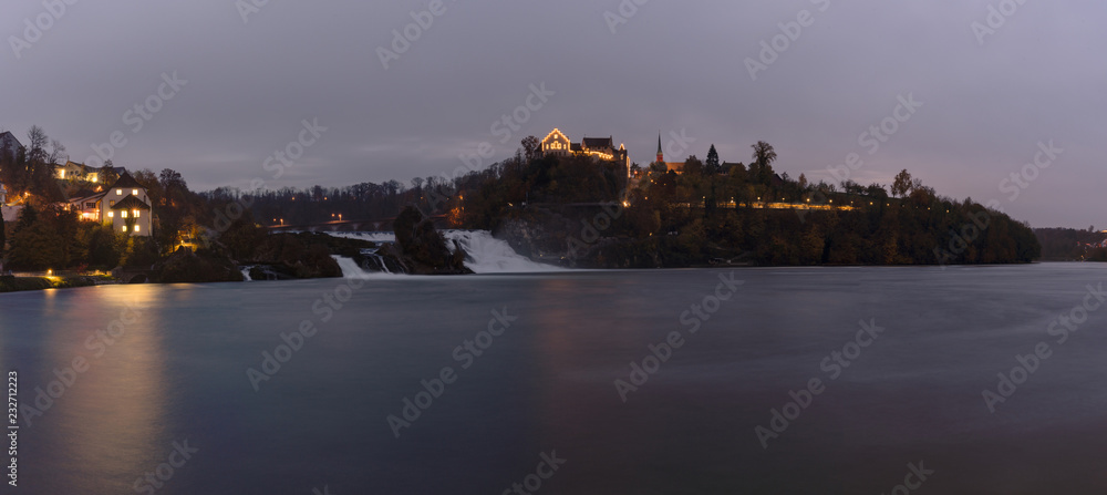 panorama view in the evening of the Rhine Falls in Schaffhausen in Switzerland with Laufen Castle in the background and historic low water levels