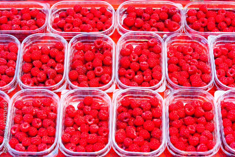 Raspberries in plastic trays Raspberries in plastic trays