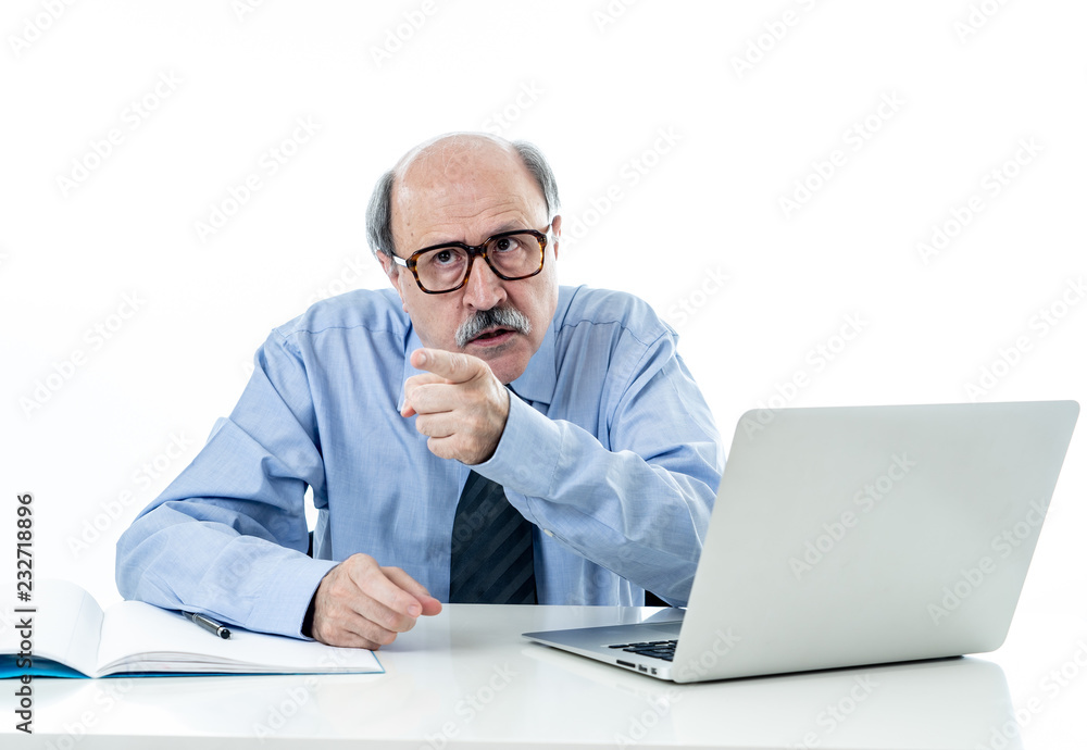 Angry older boss at work yelling and arguing at office Angry older boss at work yelling and arguing at office