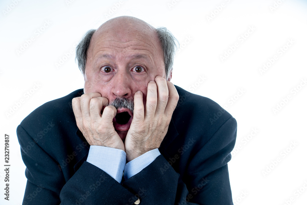 Concern scared shocked older adult man with a terrified facial expression Concern scared shocked older adult man with a terrified facial expression