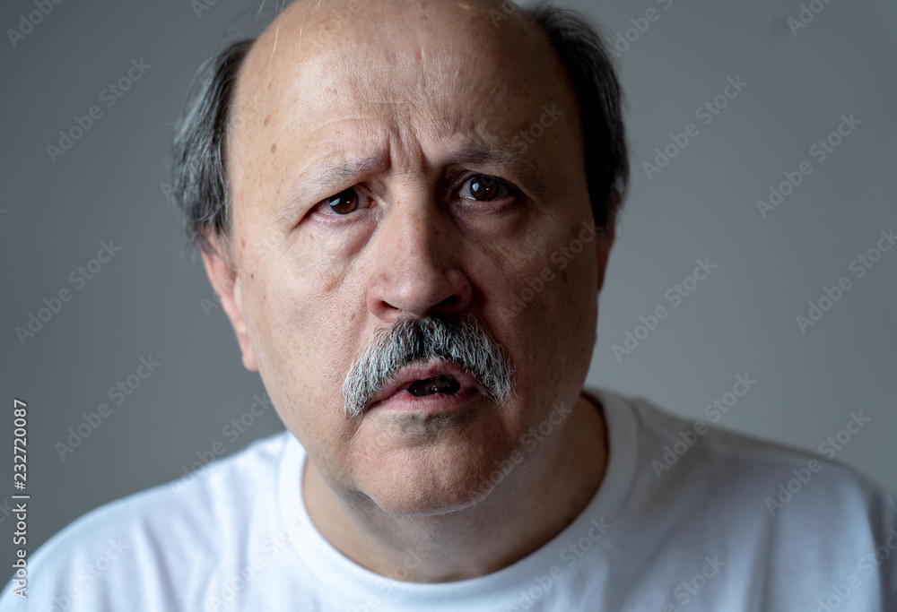 Portrait of disorientated and confused old man suffering from Alzheimer Portrait of disorientated and confused old man suffering from Alzheimer