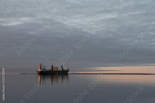 Resupply cargo barge on the waters of Nunavut near the community of Baker Lake in the Kivalliq Region