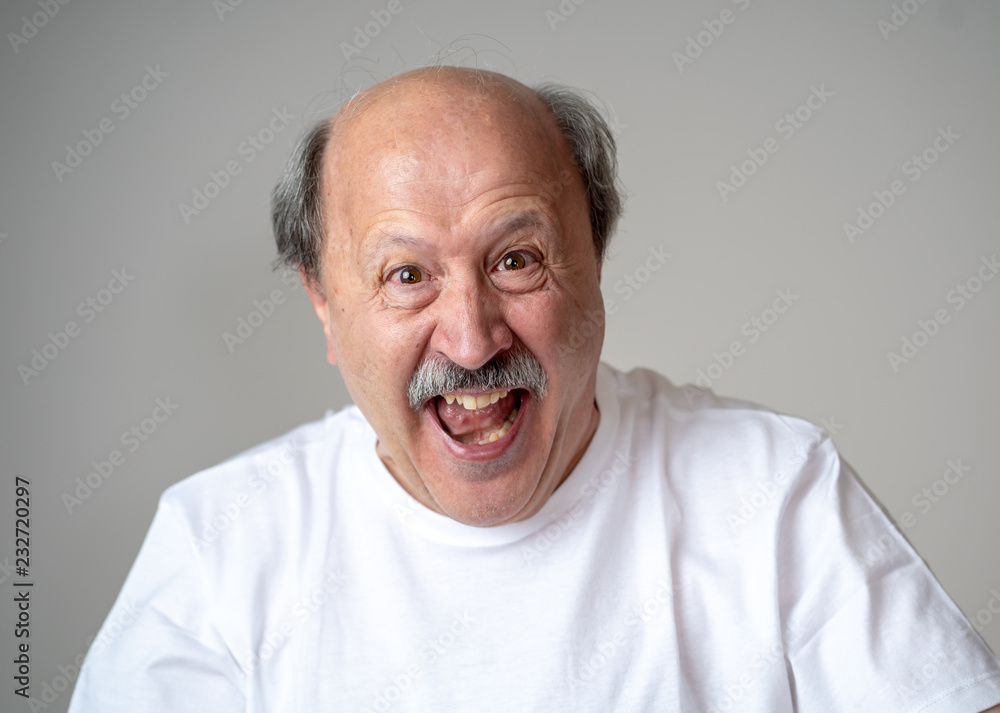 Close up portrait of surprised and happy senior man celebrating victory and wining lottery Close up portrait of surprised and happy senior man celebrating victory and wining lottery